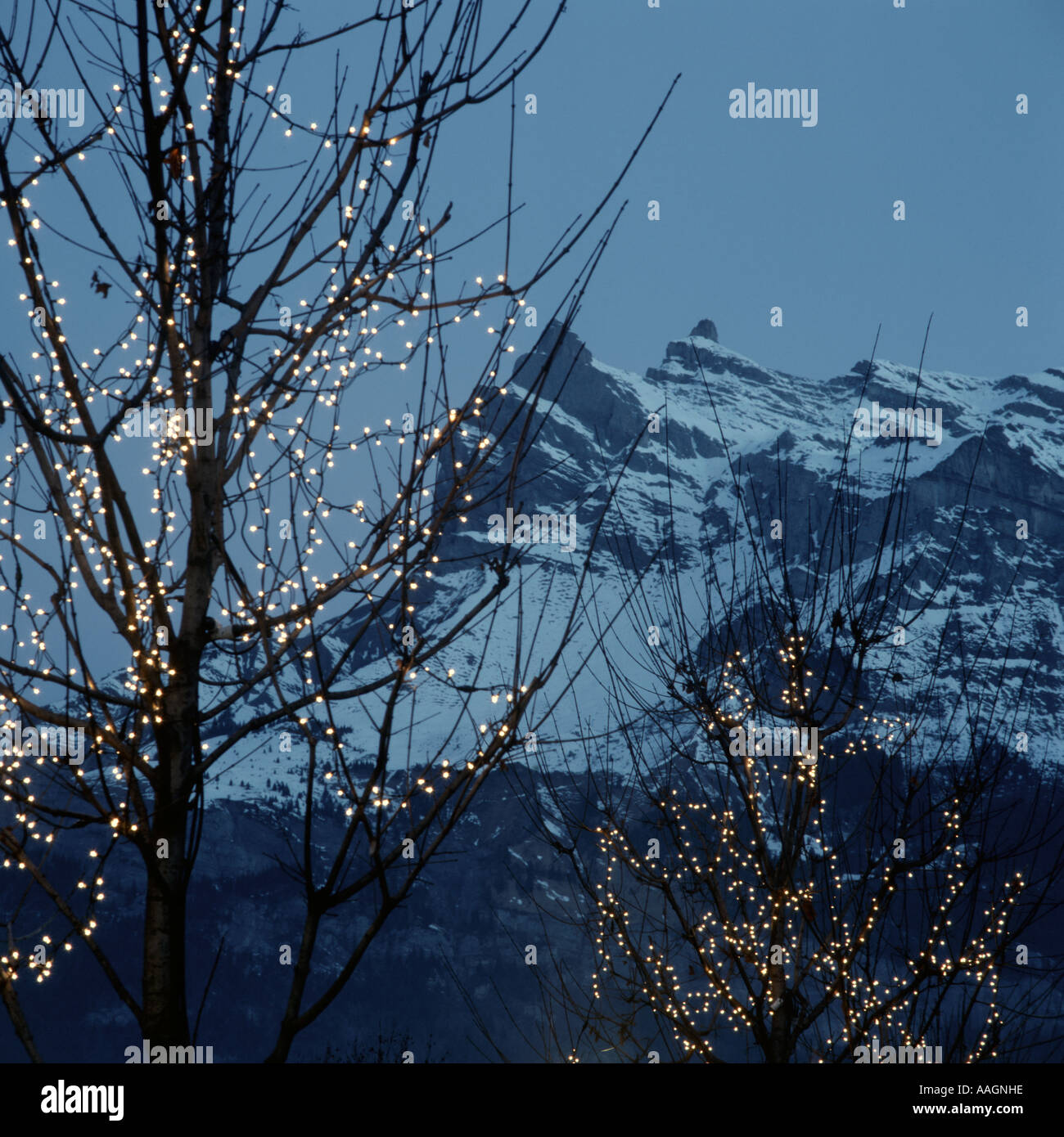 Mont Blanc and Christmas tree lights St Gervais les Bains Haute Savoie Rhone Alpes France Stock Photo
