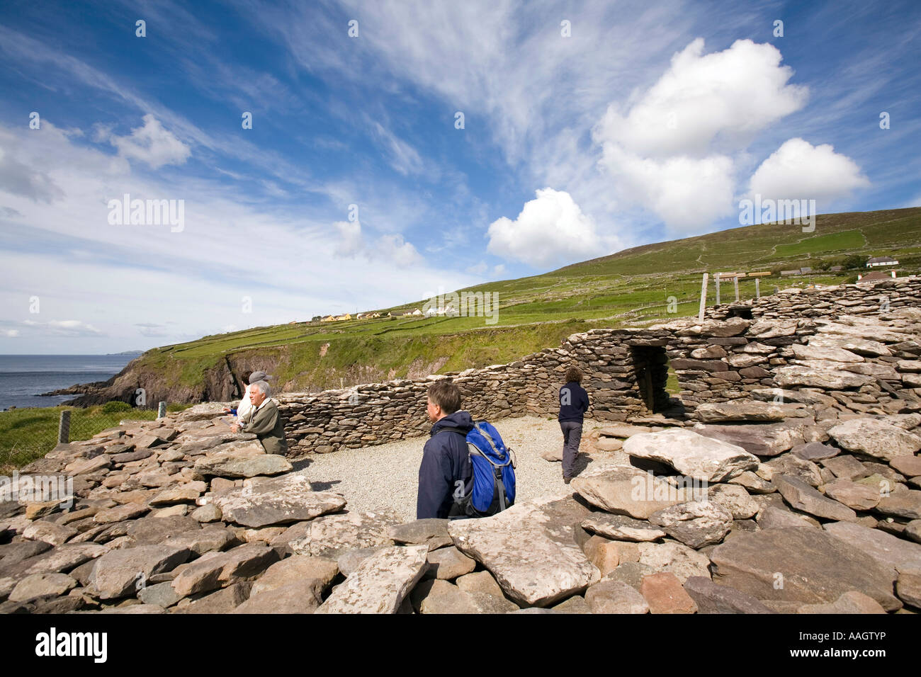 Ireland County Kerry Dingle Peninsula Slea Head visitors in Dunbeg Fort on clifftop Stock Photo