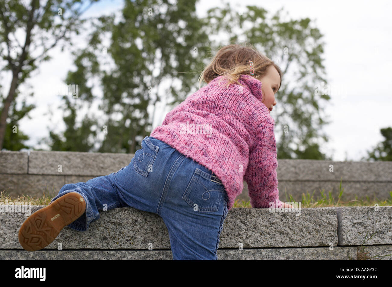 young girl climbing steps Stock Photo Alamy