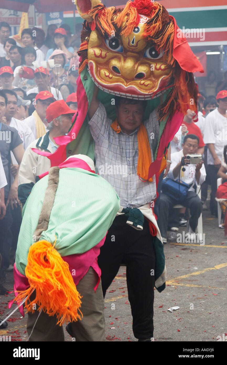 Man Holding Up Chinese Dragon At Matsu Festival Stock Photo