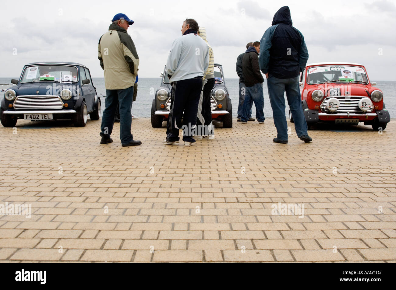 mini car owners rally Aberystwyth promenade in the rain, Wales UK Stock