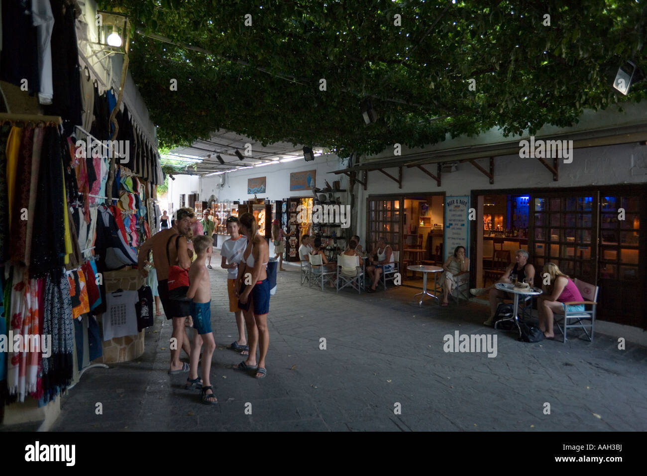 Tourists shopping at roofed shopping street Lindos Rhodes Greece Stock