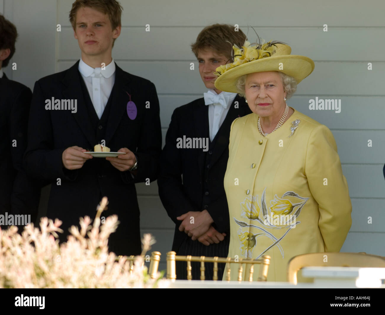 Queen Elizabeth with Eton College students for the annual tea party at Guards Polo Club Windsor Park Stock Photo