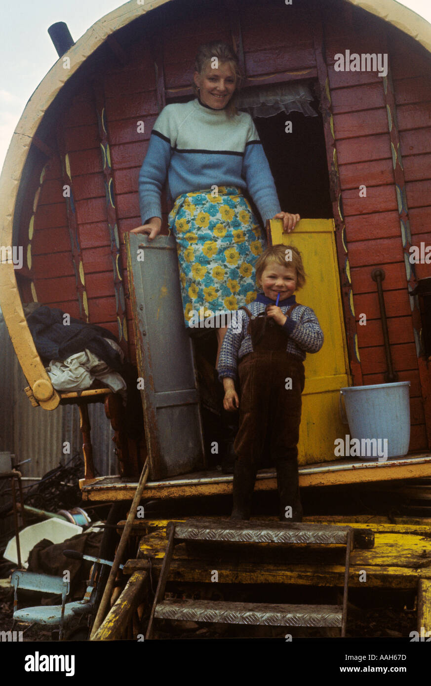 Gypsy camp family mother and son traditional wooden bow topped caravan Belfast Northern Ireland Irish Traveller family. 1970s 1970 UK HOMER SYKES Stock Photo