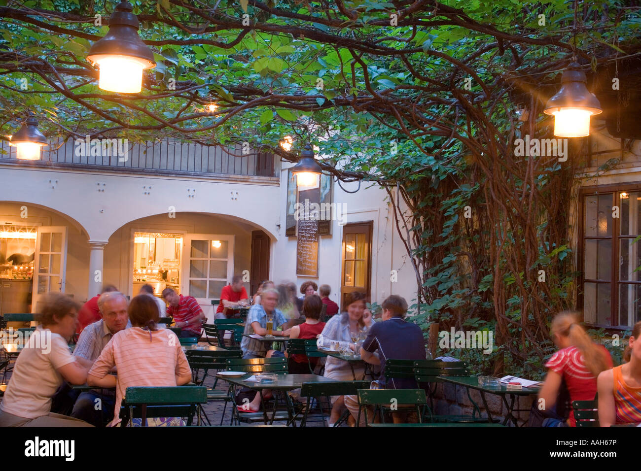 People sitting in the garden of Amerlingbeisl Spittelberg Vienna Austria Stock Photo