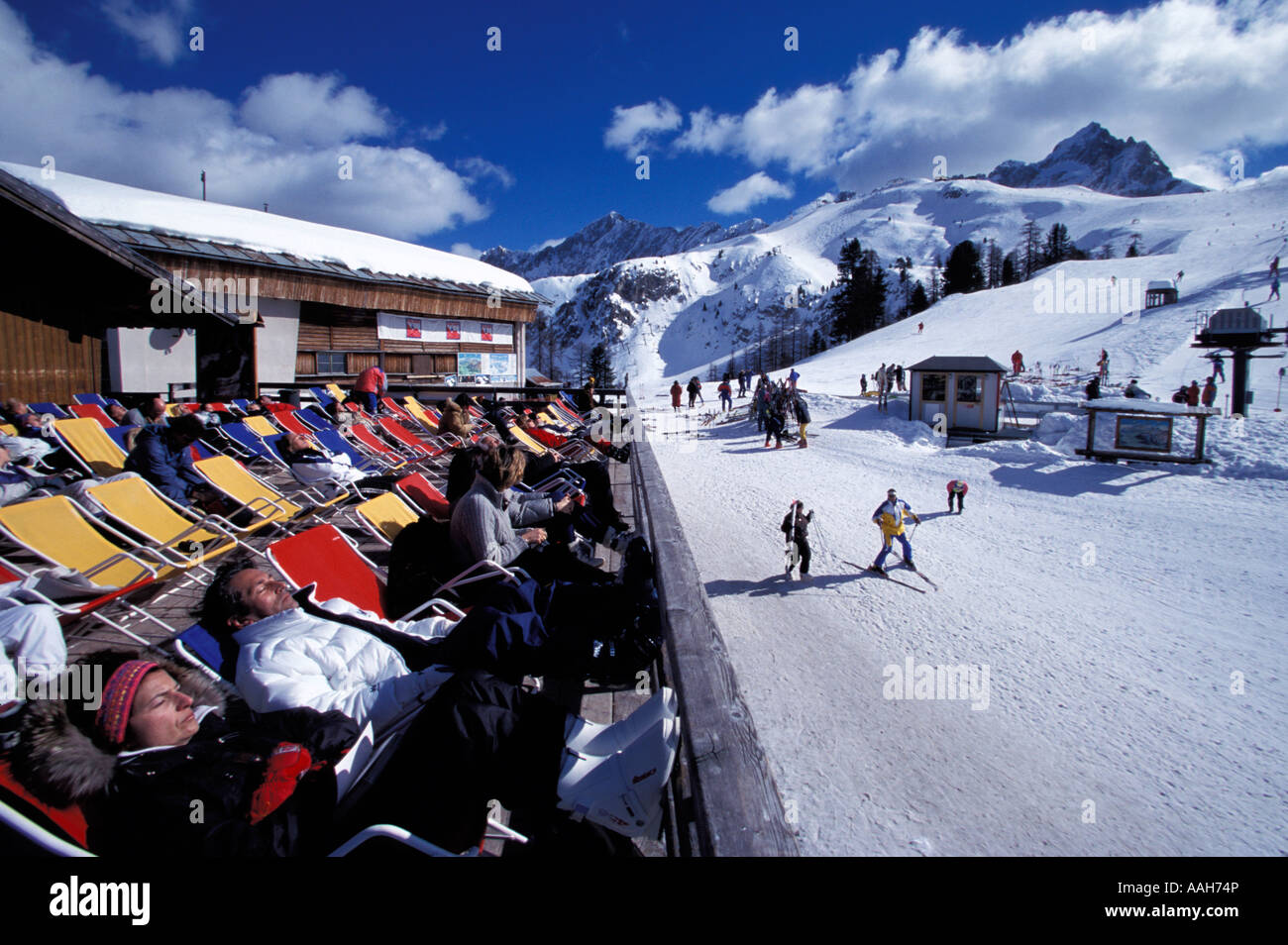 Relaxing on a terrace of a hut Cortina d Amprezzo Dolomites Italy Stock Photo