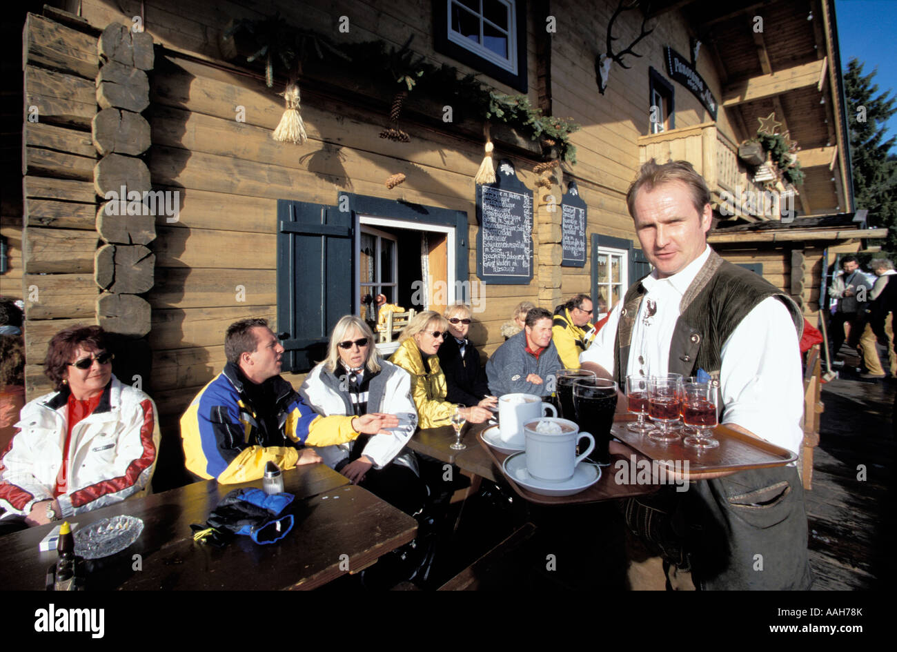 Waiter serving drinks Panorama Alm Saalbach Hinterglemm Salzburg state Austria Stock Photo