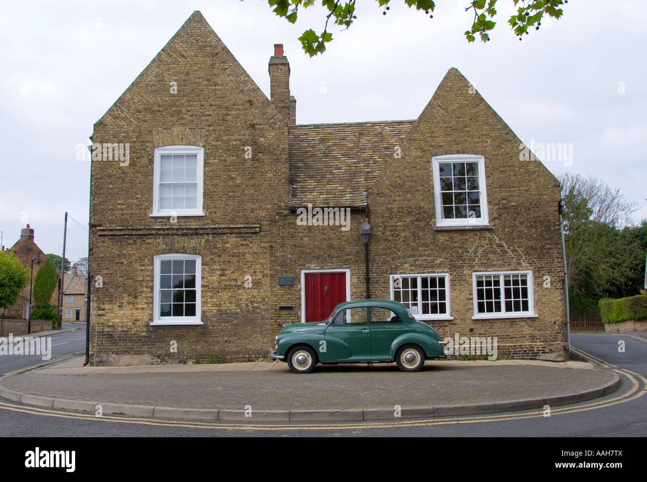 Morris minor parked in front of a house Ely England Stock Photo