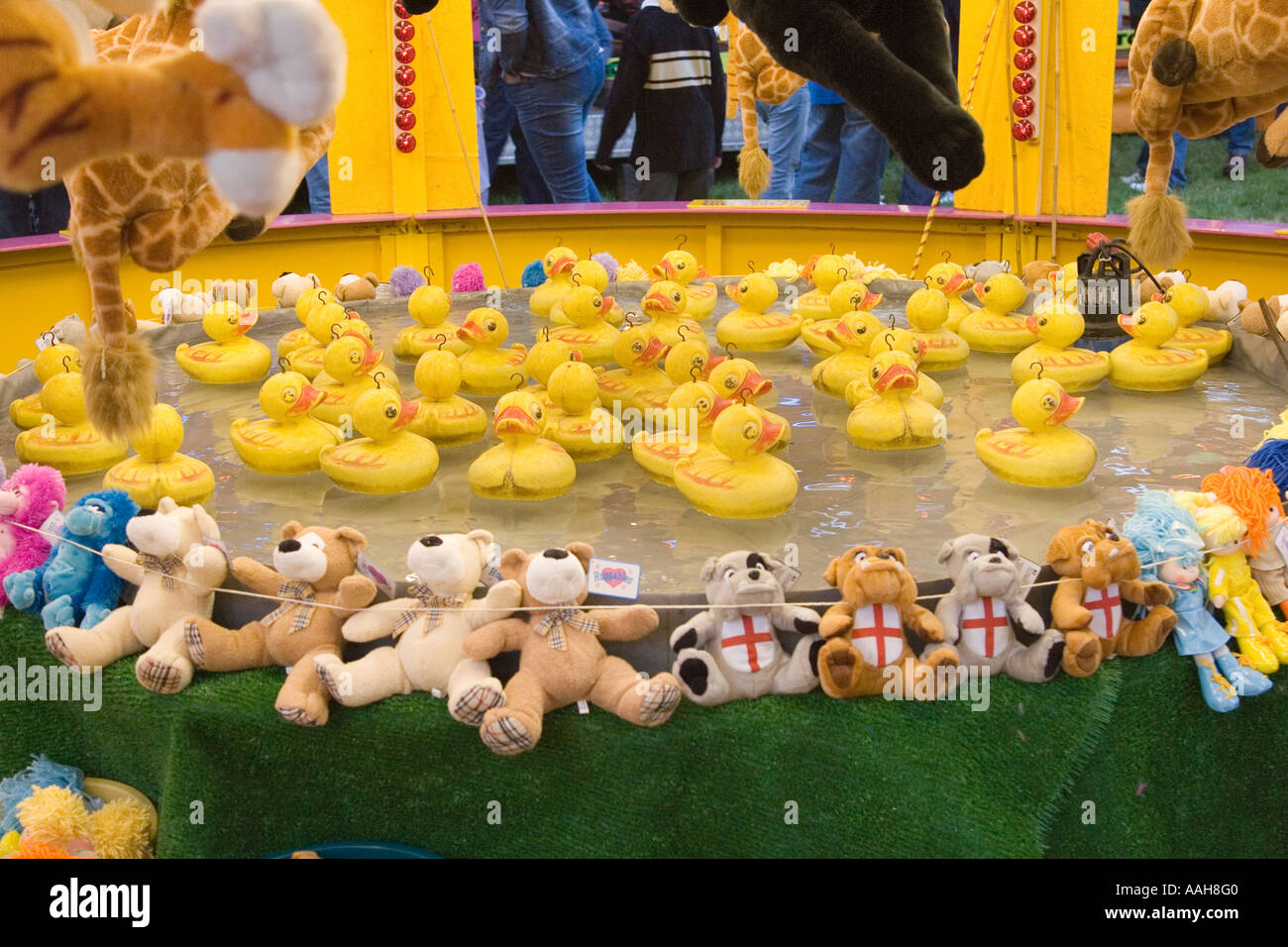 A hook a duck game stall at the funfair at Bardwell in Suffolk, UK