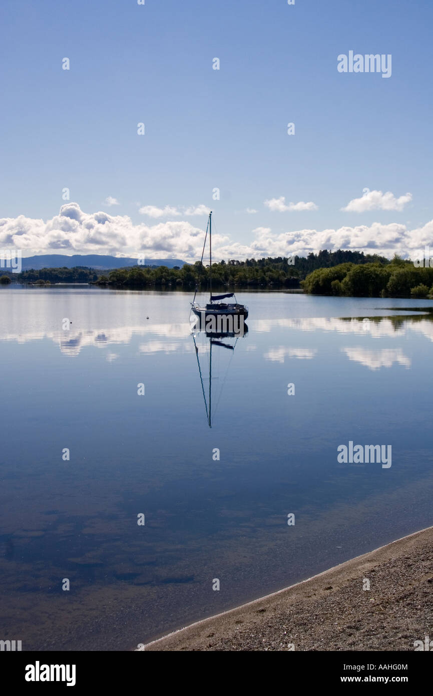 Sailing boat at anchor on Loch Lomond near Luss Pier, Luss, Argyll and