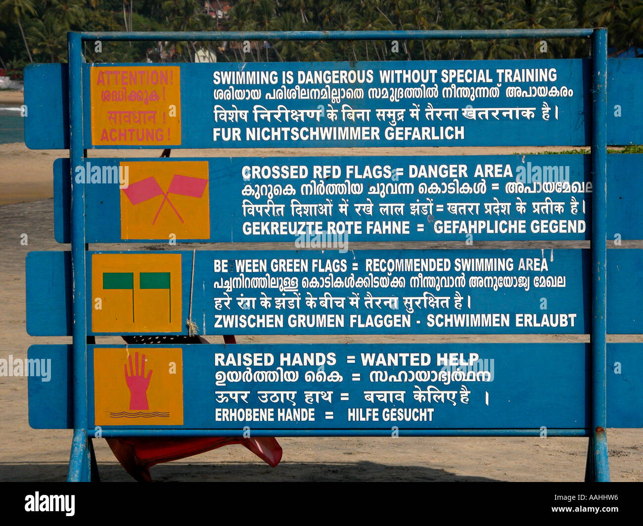 Safe swimming signs in multiple languages at an Indian beach Stock