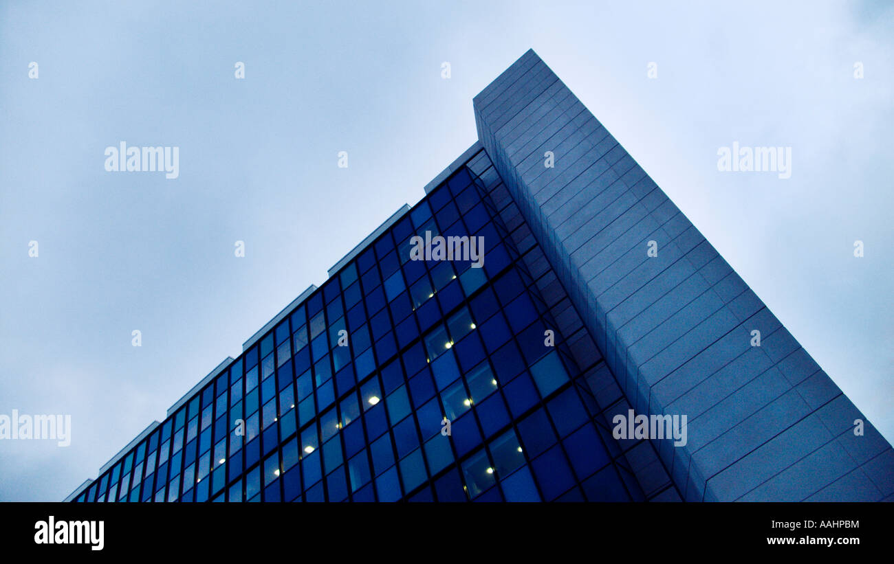 Sharp corner of a modern office building against the sky Stock Photo