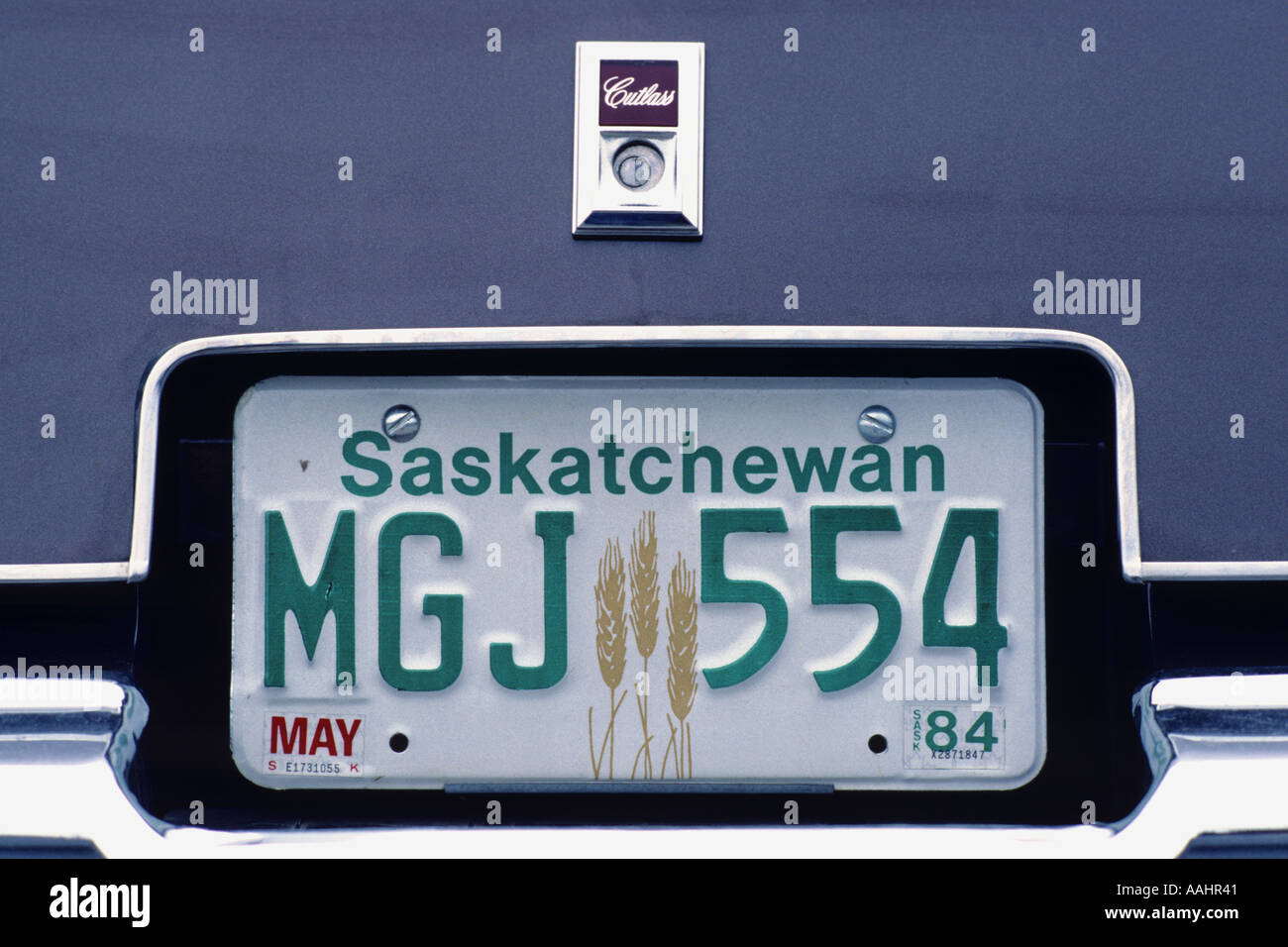 Canadian Saskatchewan car registration license plate MGJ 554 May 1984 on Oldsmobile Cutlass JMH0647 Stock Photo