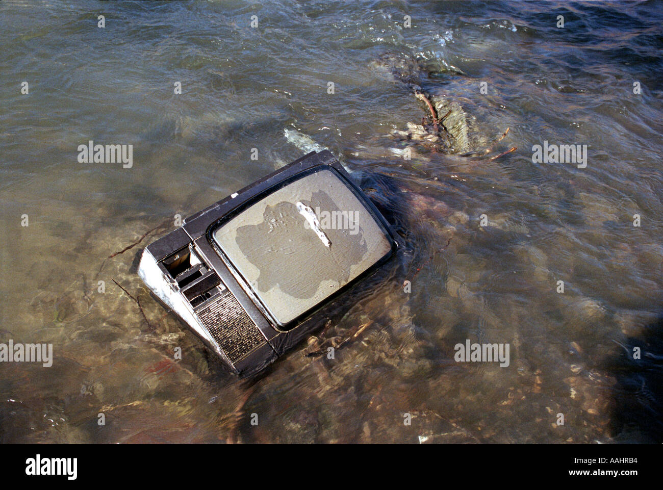 old tv dumped in river Stock Photo Alamy
