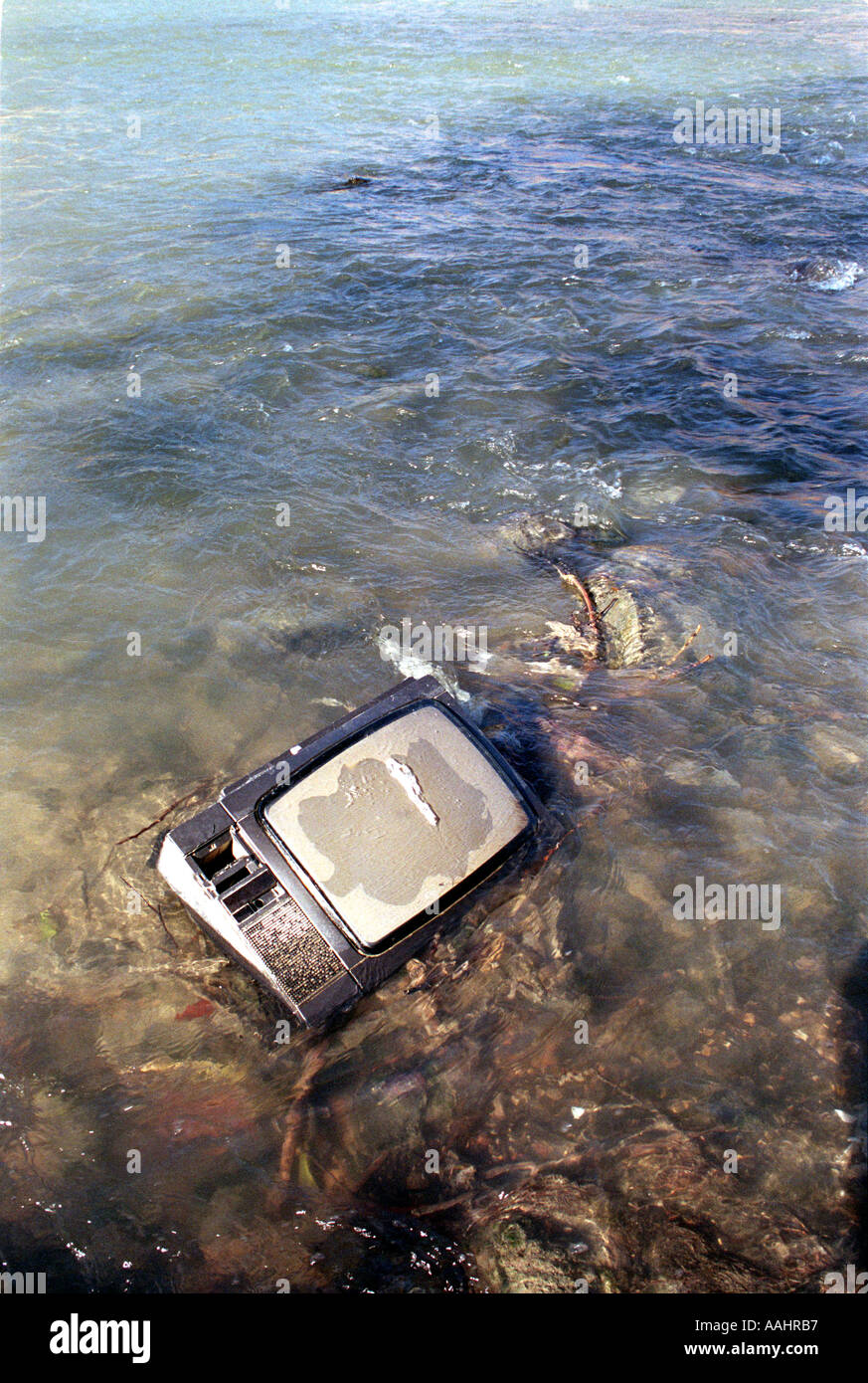 old tv dumped in river Stock Photo Alamy