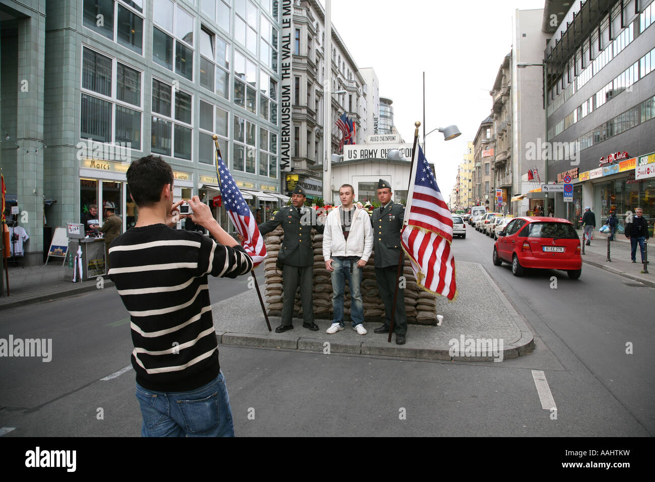 Tourists at Check Point Charlie, Berlin Stock Photo