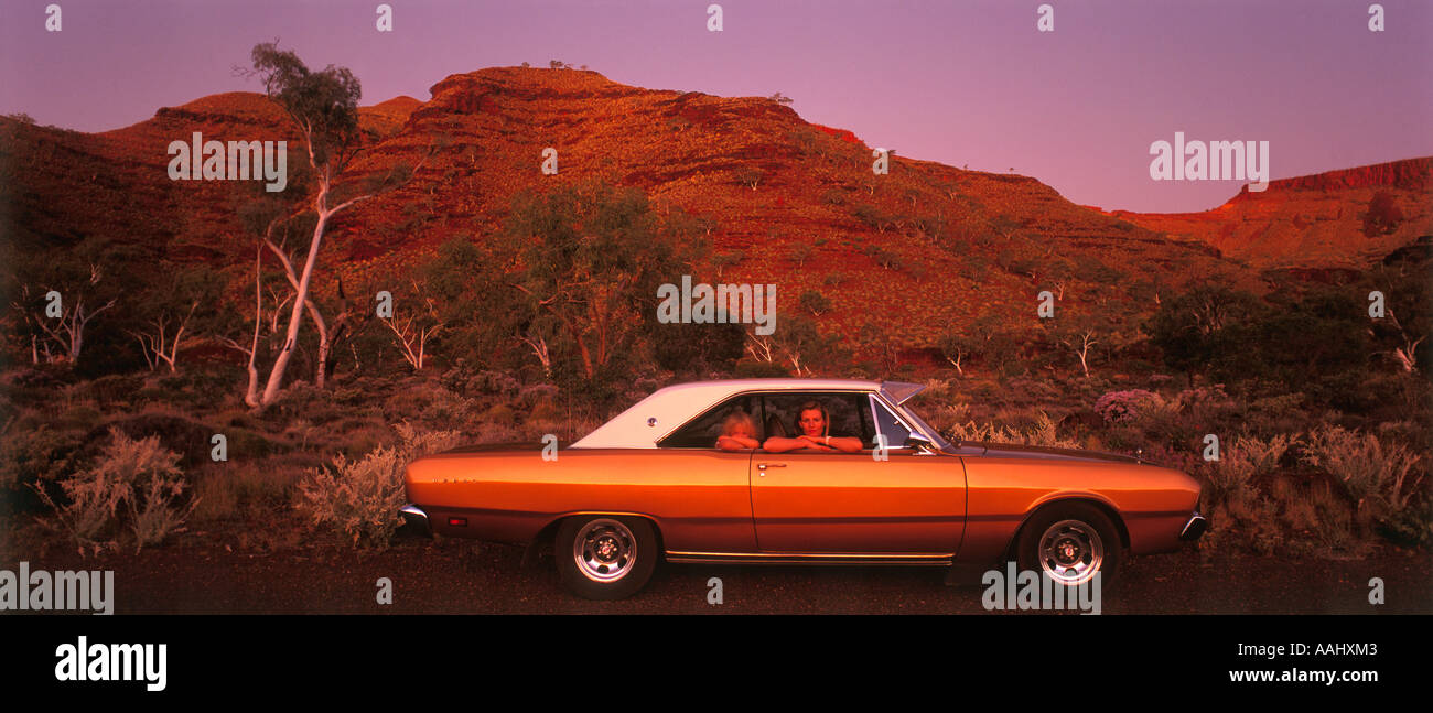 Mother and daughter in their car Wittenoom Gorge Wittenoom Pilbara Region Western Australia panoramic Stock Photo