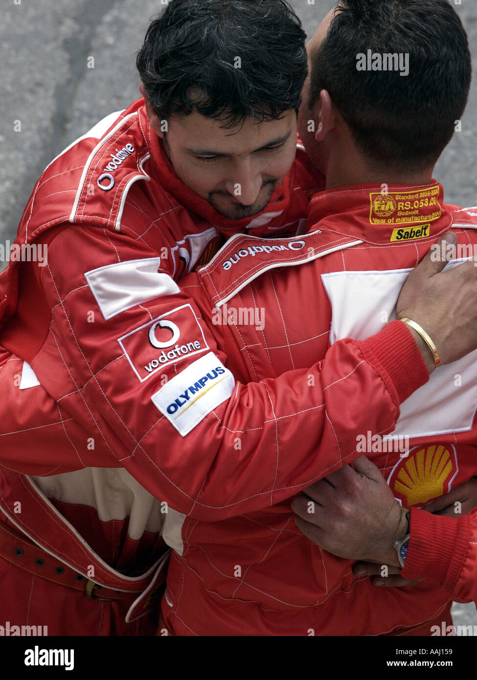 Ferrari team members celebrating Stock Photo Alamy