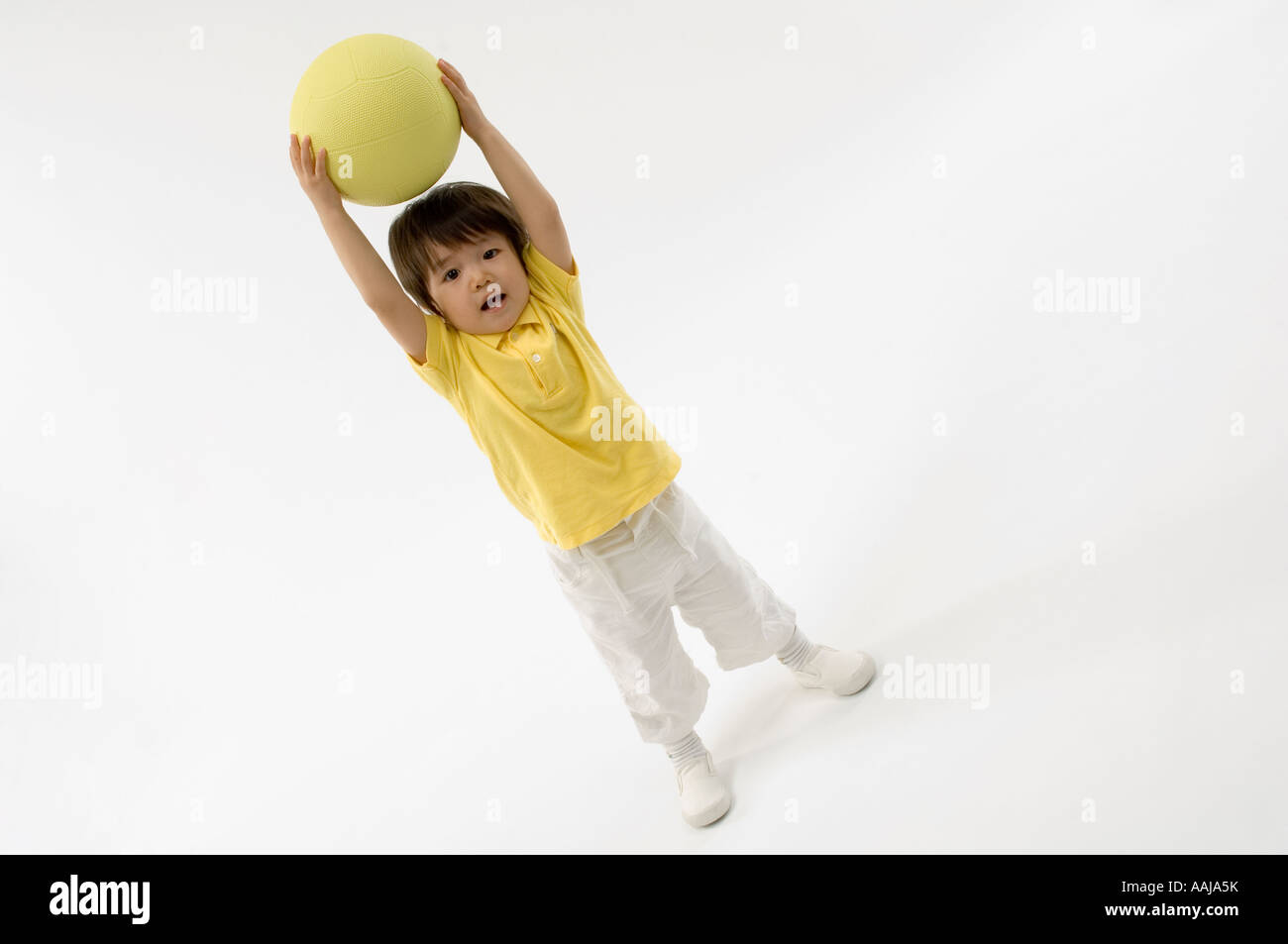 Boy playing with ball Stock Photo - Alamy