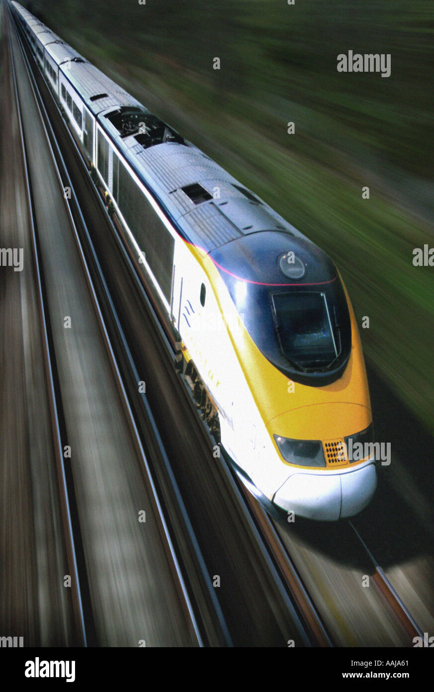 Eurostar train travelling at speed on railway track Stock Photo