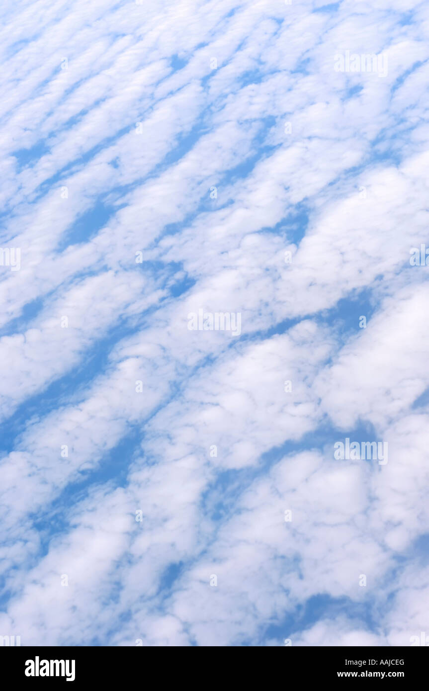 White clouds over blue Altocumulus undulatus clouds Stock Photo