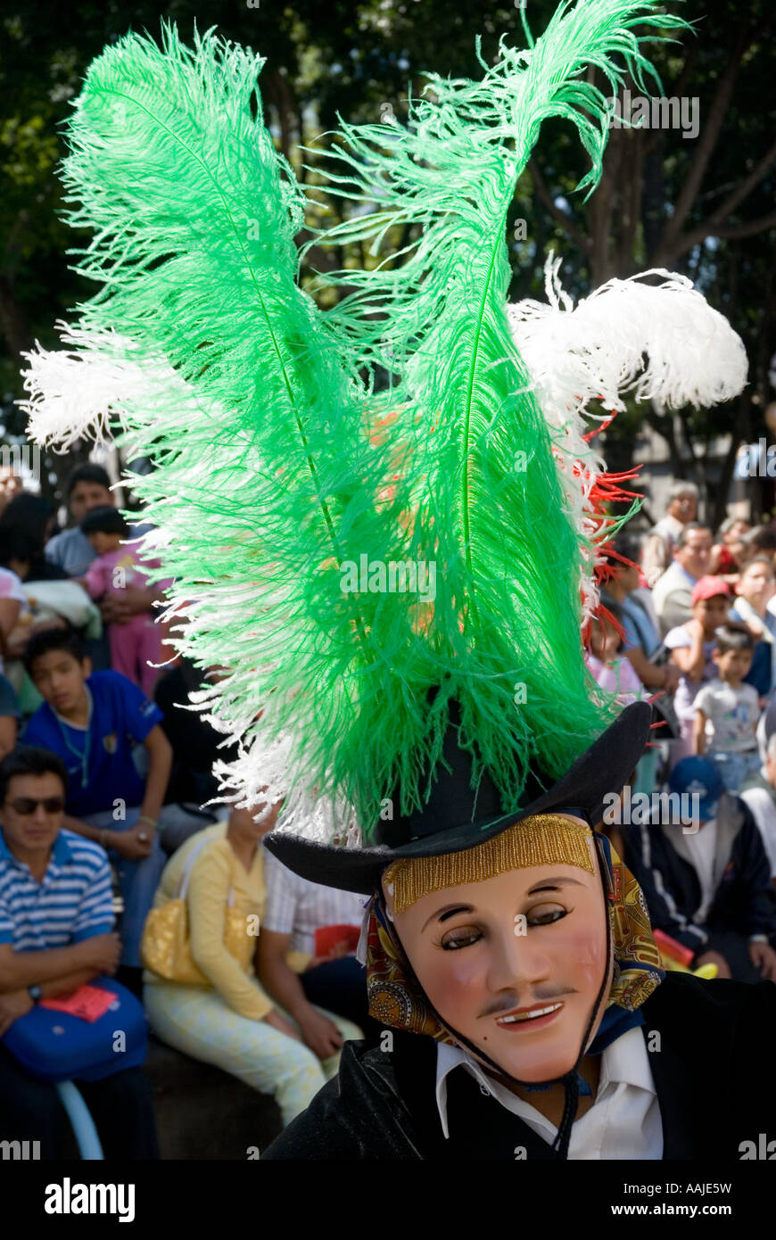 dancing mask with a green feather in the hat carnival of puebla, mexico  Stock Photo - Alamy