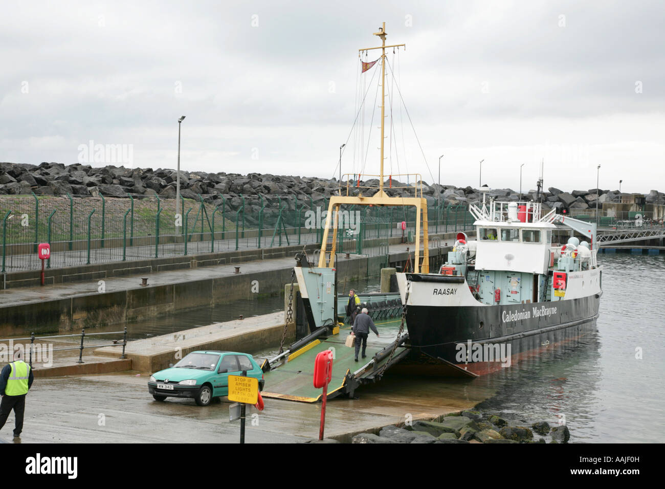 Car driving off the Rathlin Island ferry Raasay at ...