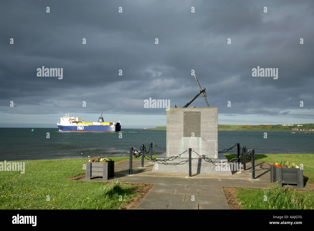 Ferry leaving Larne, County Antrim, Northern Ireland passing memorial to shipwrecked MV Princess Victoria. Stock Photo