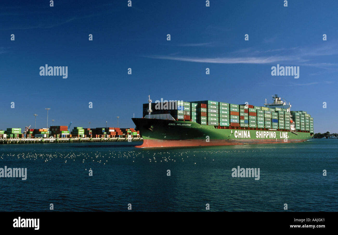 China Shipping container ship arriving through the main channel in San Pedro Harbor, Los Angeles, California Stock Photo