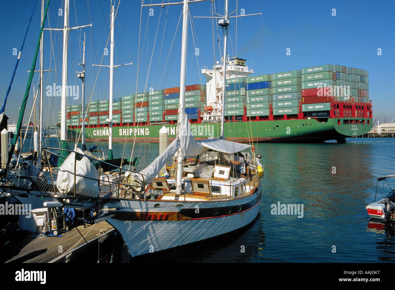 China Shipping container ship arriving through the main channel in San Pedro Harbor, Los Angeles, California Stock Photo