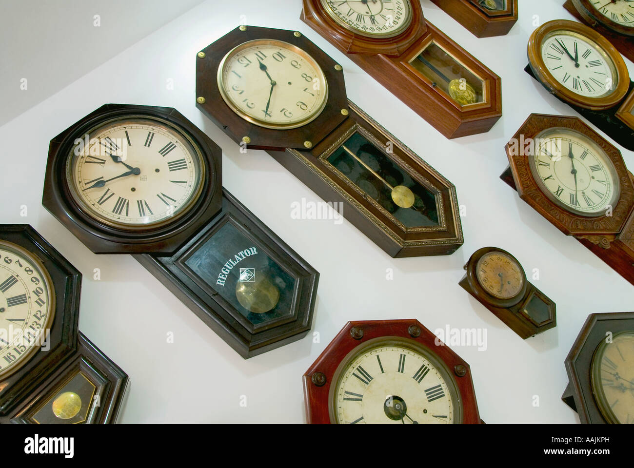 collection of antique clocks, many clocks in a wall Stock Photo Alamy