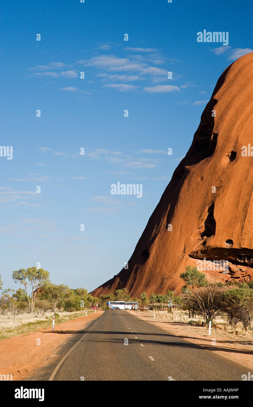 Road and Uluru Ayers Rock Uluru Kata Tjuta National Park World Heritage Area Northern Territory Australia Stock Photo