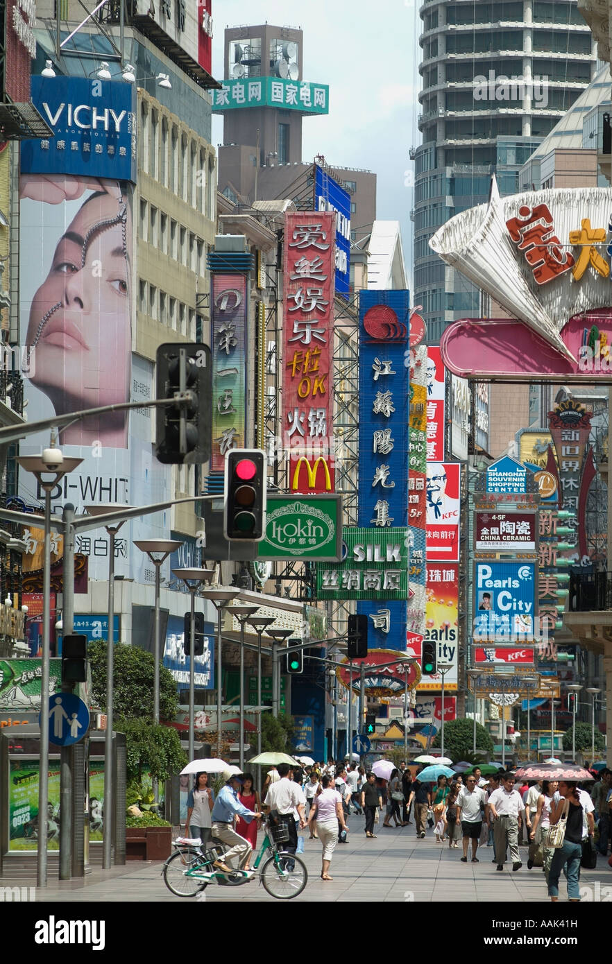 Billboards and shop signs along Nanjing Road in Shanghai China  Photo by Chuck Nacke Stock Photo