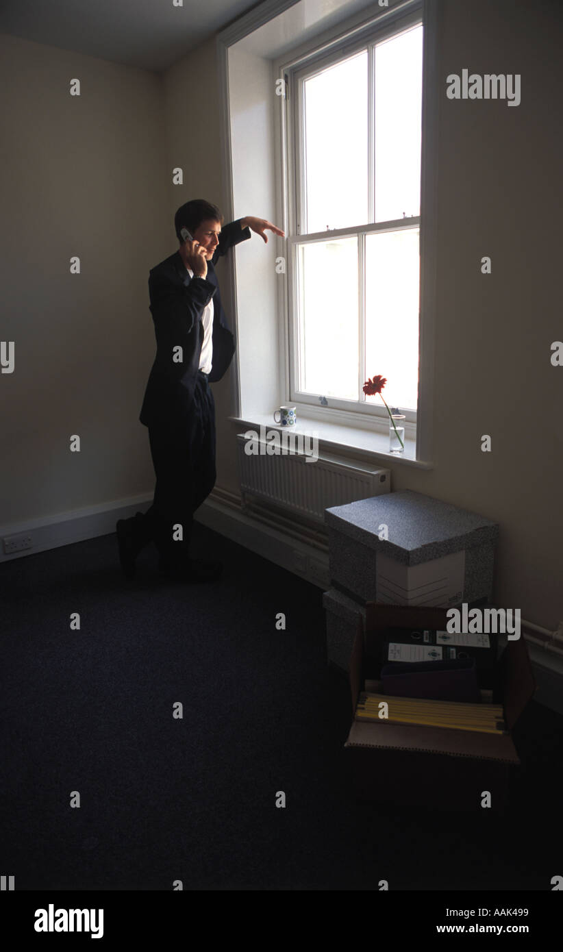 Young businessman in empty office Stock Photo