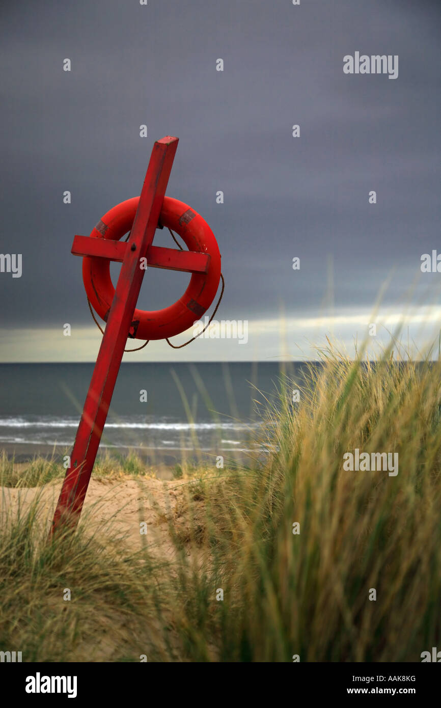 Lifesaver on Bamburgh beach Northumberland Stock Photo