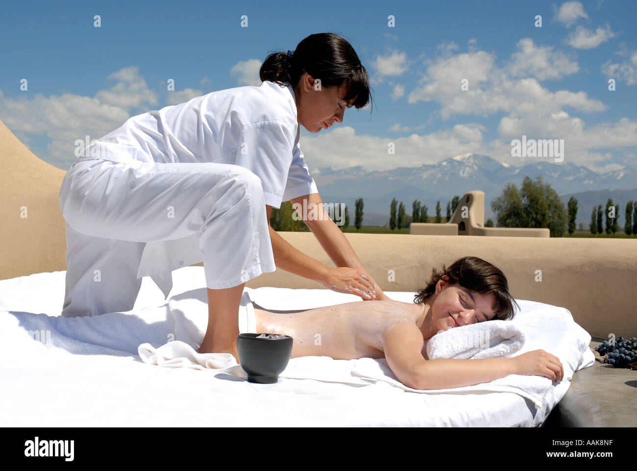 Woman having a massage in the sunshine at Cavas Wine Lodge Mendoza Argentina Stock Photo