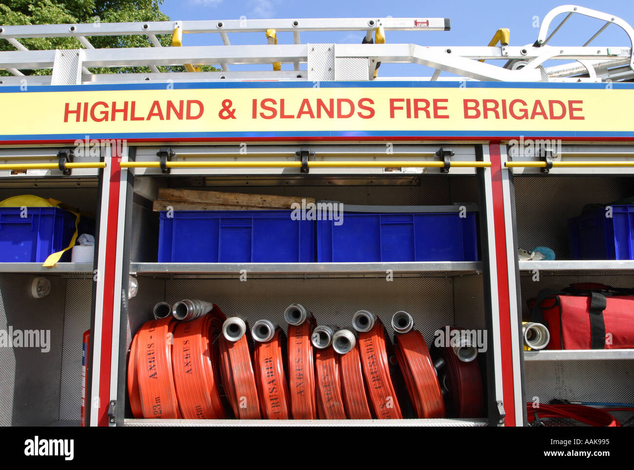 Fire engine emergency equipment water hoses and ladders Stock Photo