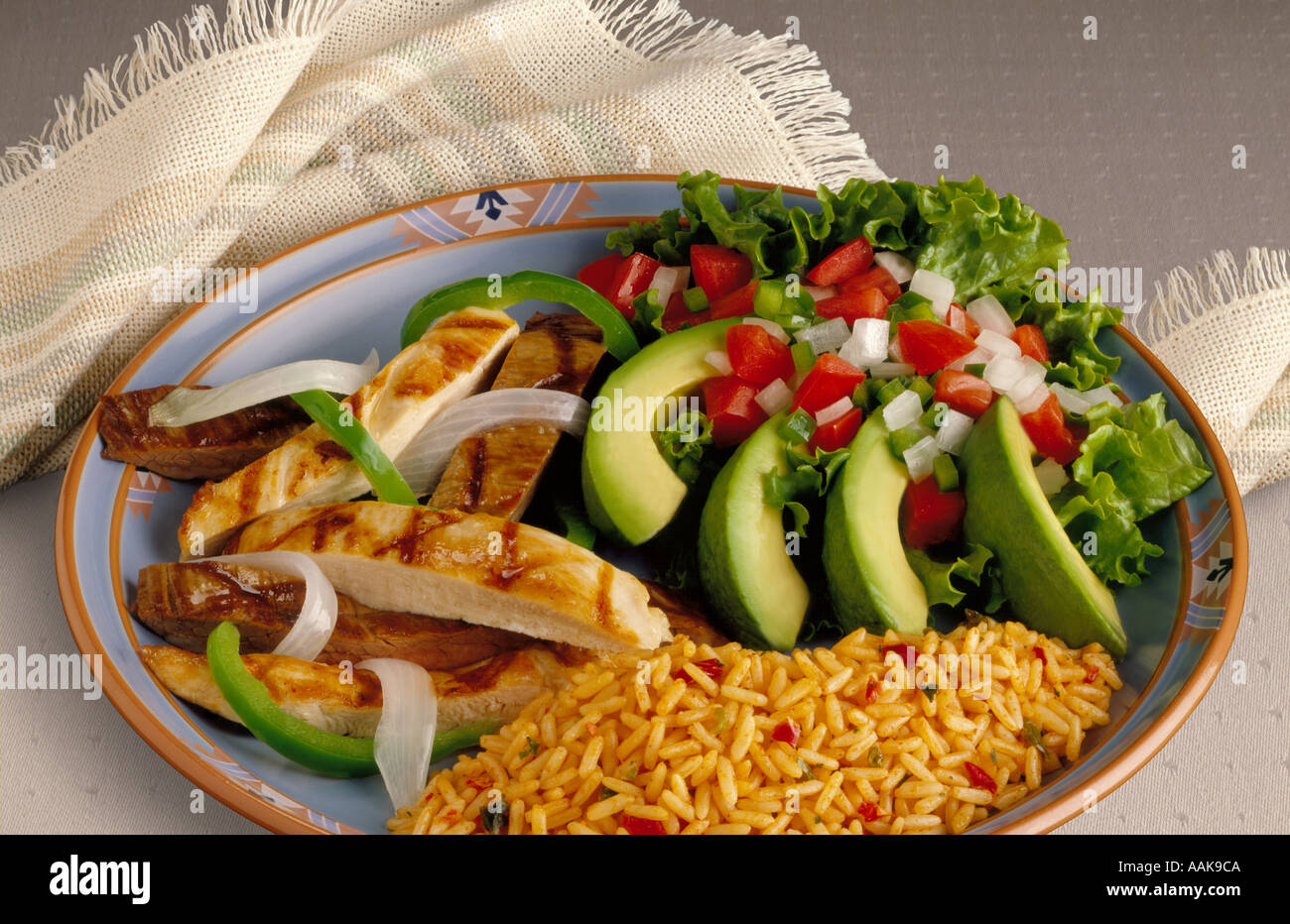 fajitas beef and chicken Mexican Tex Mex dish served with avocado pico