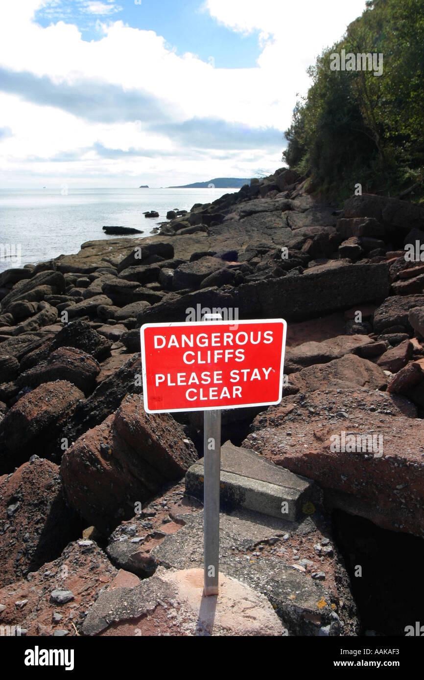Dangerous cliffs warning sign at near Torquay Devon England