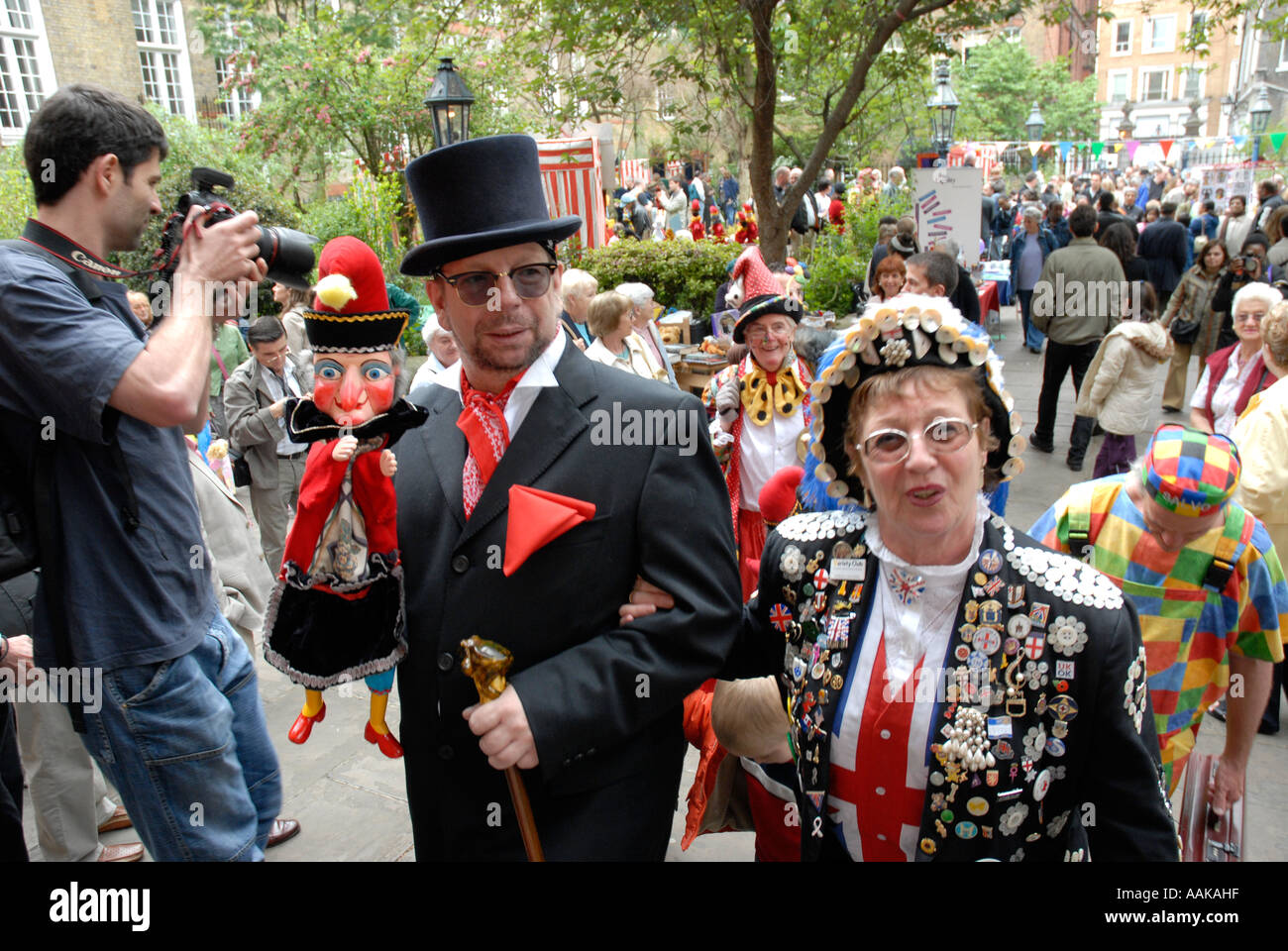 Pearly Kings and Queens in the grounds of St Pauls Church Covent Garden London Stock Photo