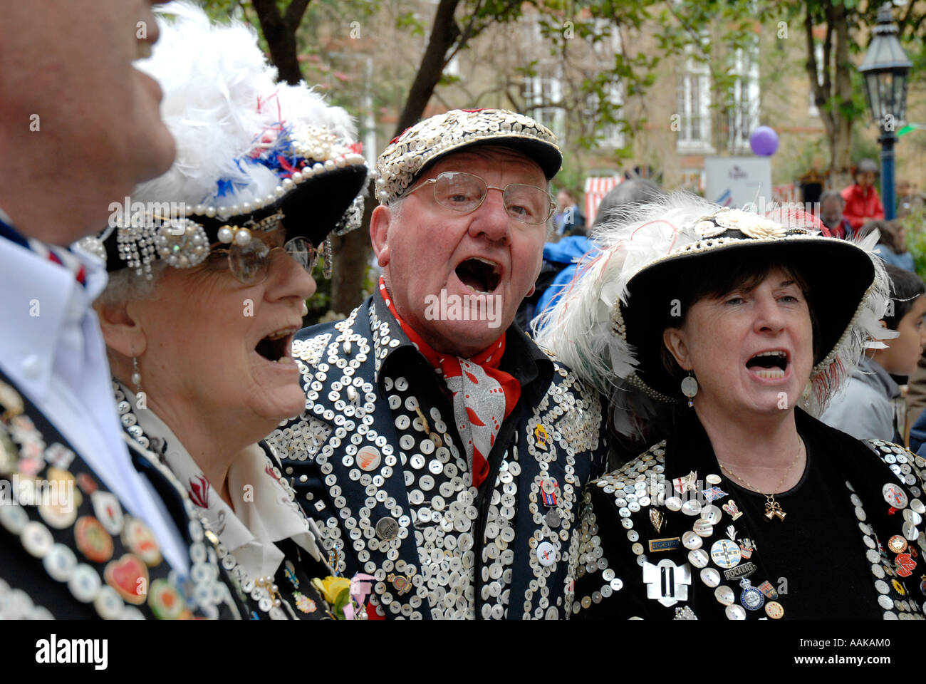 Pearly Kings and Queens in the grounds of St Pauls Church Covent Garden London Stock Photo