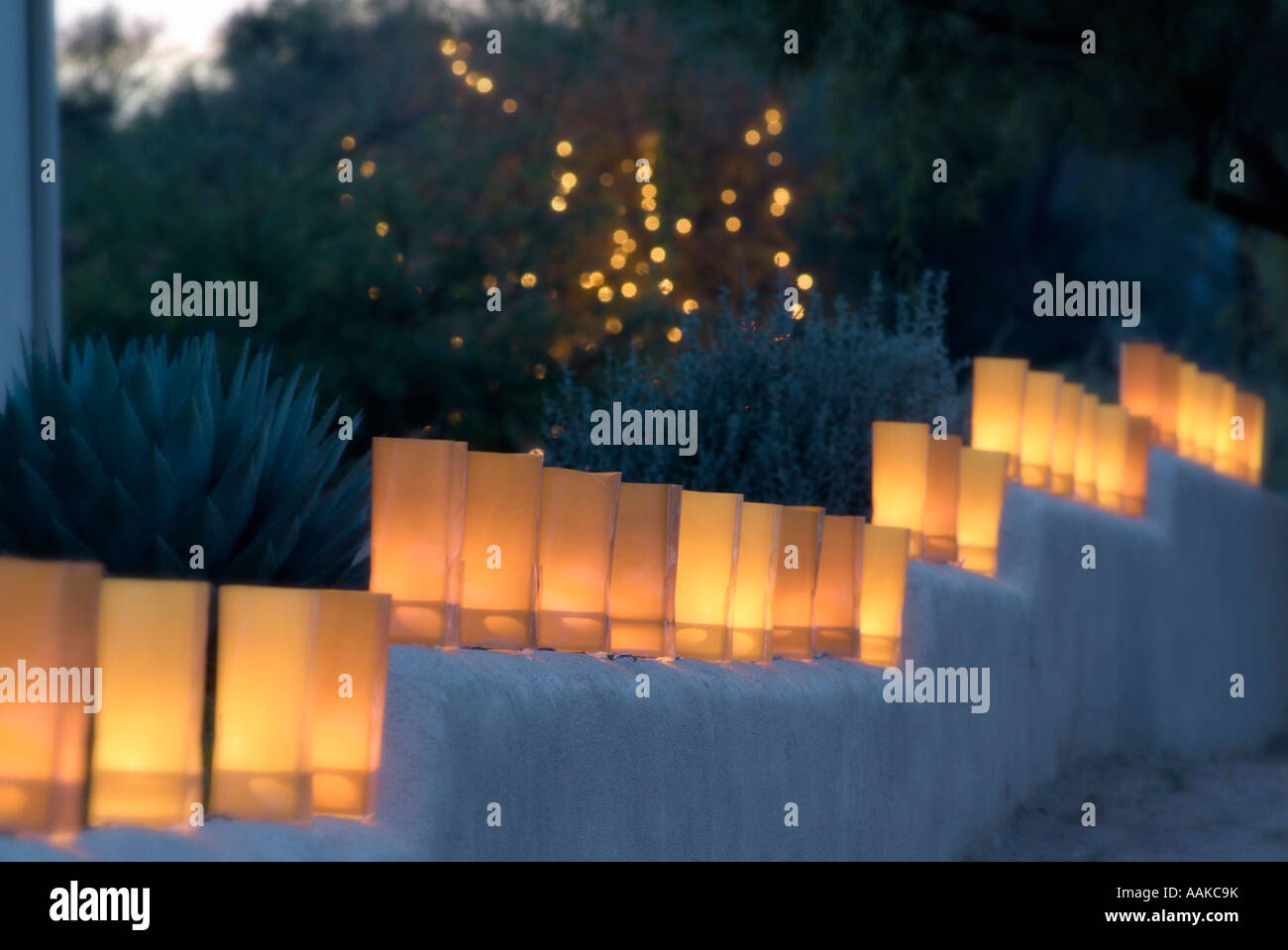 Luminaries line a wall in the desert Southwest Stock Photo
