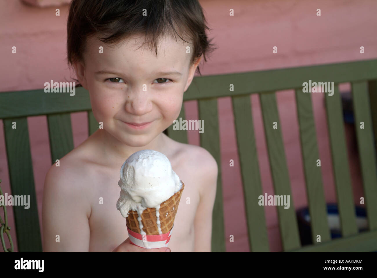 Boy with Melting Ice Cream Cone Stock Photo