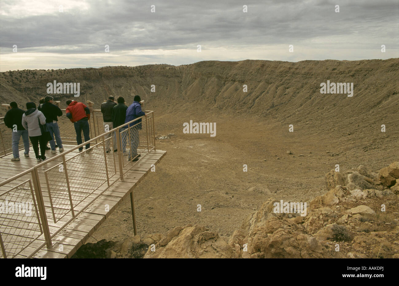 Tourists look into Meteor Crater near Winslow Arizona Stock Photo