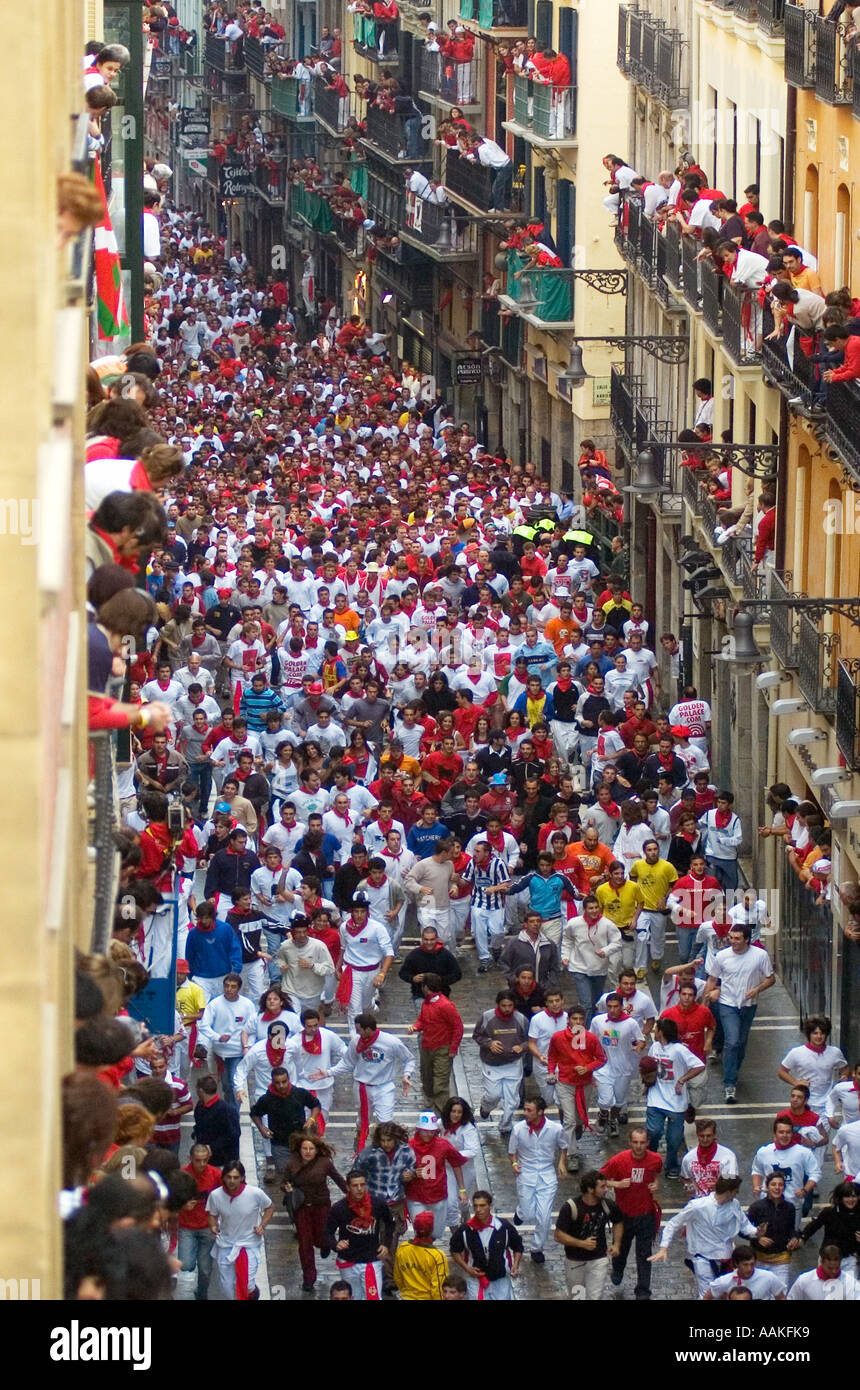 Running of The Bulls in Calle Estafeta, Fiesta de San Fermin (Encierro) Pamplona, Navarra, Spain. Stock Photo