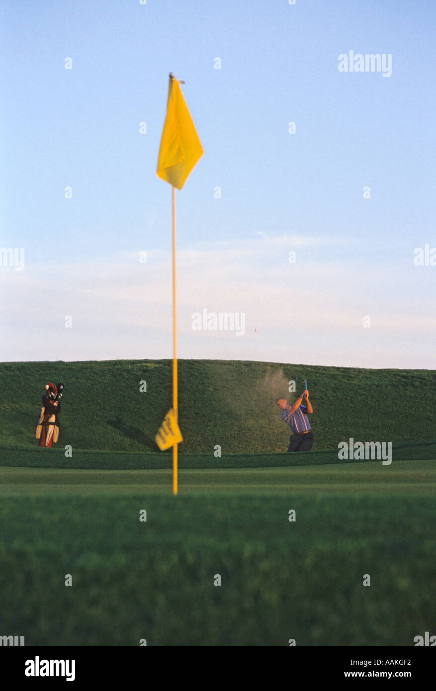Golfer hitting from sand trap Stock Photo Alamy