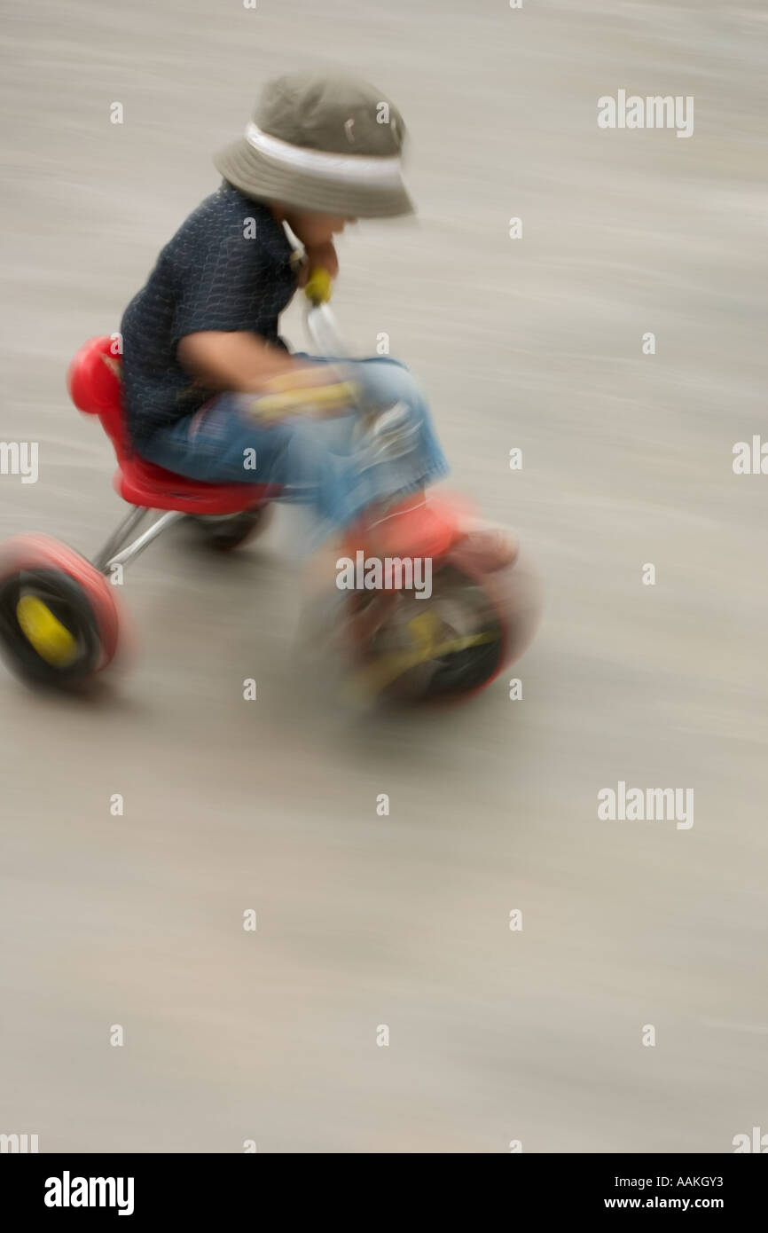 Blurred movement on a tricycle Stock Photo