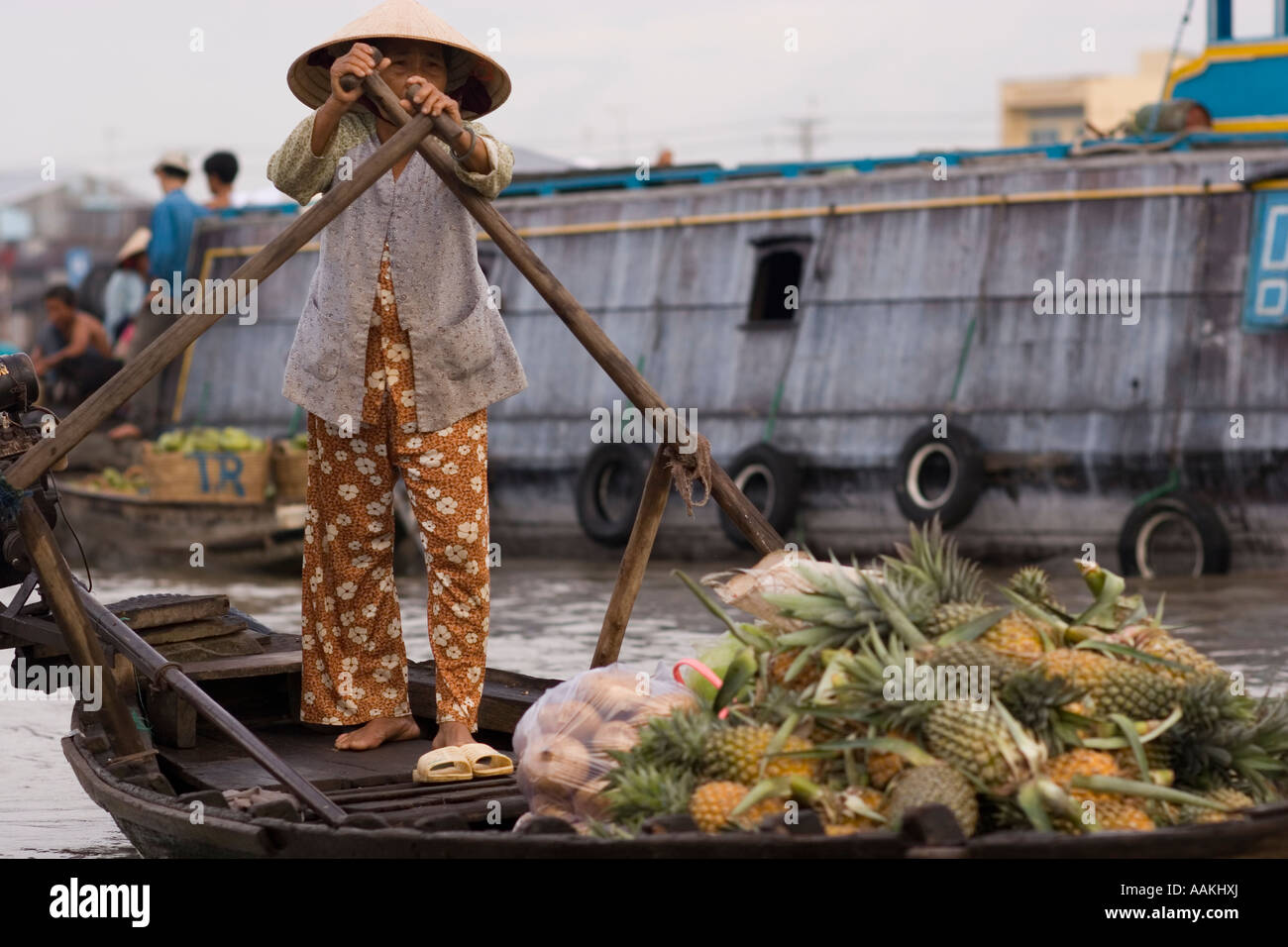 Woman rowing boat Cai Rang floating market near Can Tho Mekong delta ...
