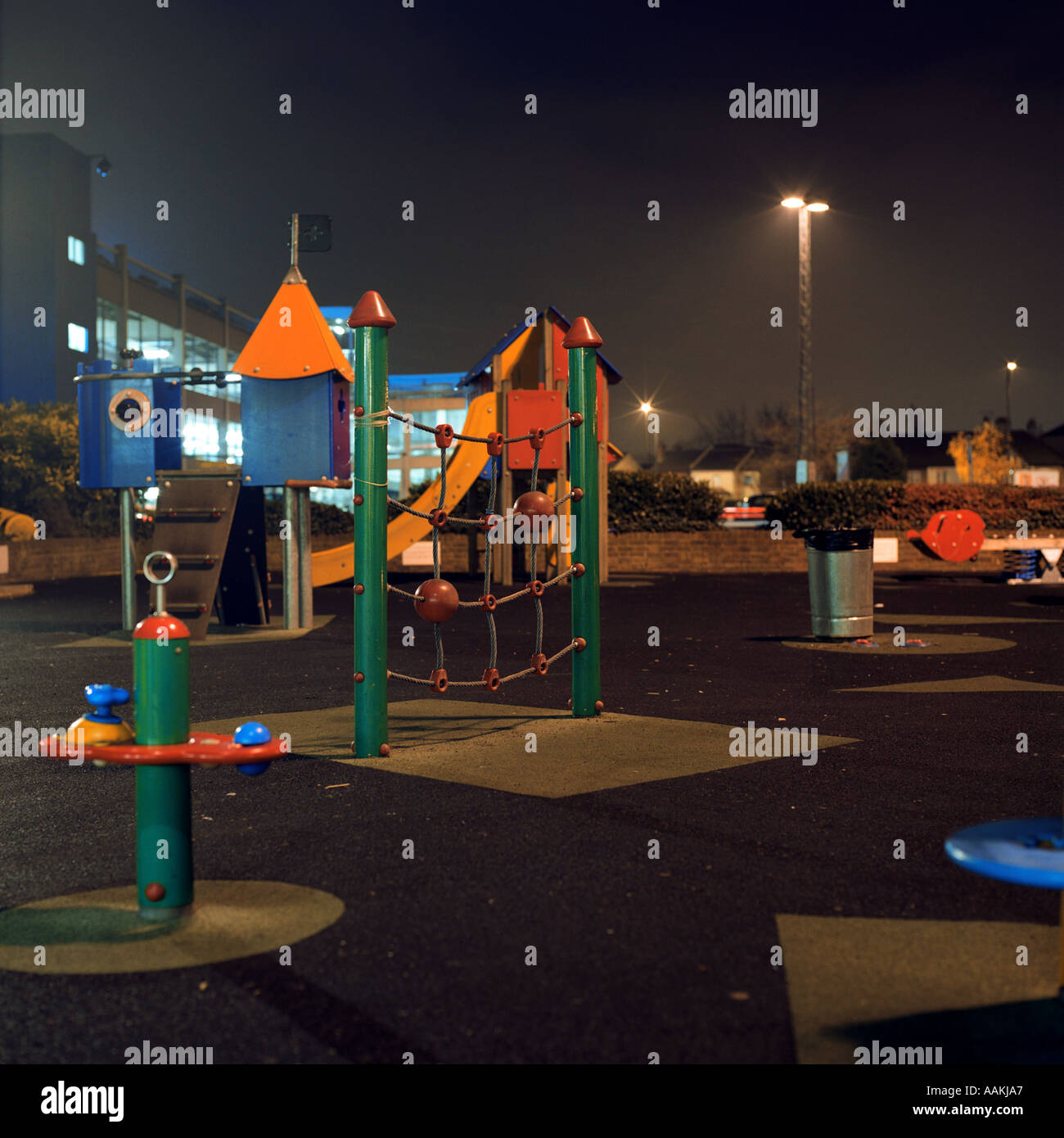 night shot of deserted children s playground at IKEA Brent Cross north London inc climbing frame Stock Photo