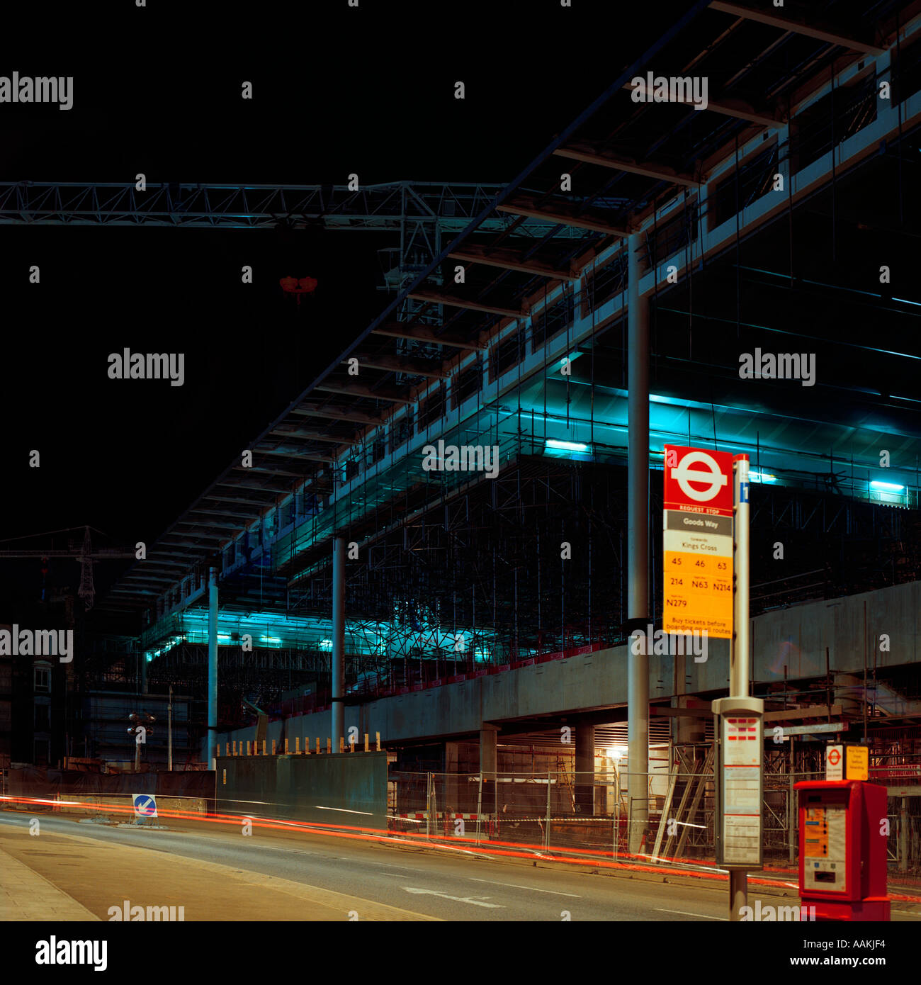 night shot of construction work for Eurostar terminal at King s Cross London inc temporary bus stop Stock Photo